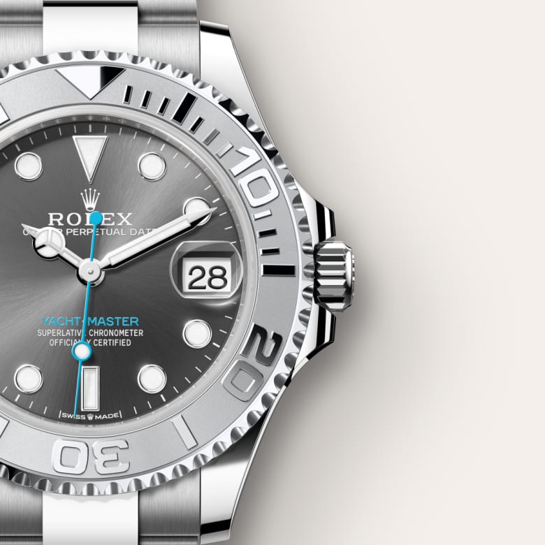 Close-up of a silver Rolex Yacht-Master watch showing the face, bezel, and part of the metal band.