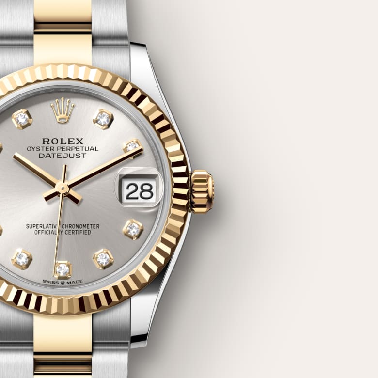 A silver and gold Rolex Datejust watch with a diamond hour markers and the date displayed at 3 oclock.