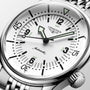 Close-up of the Longines Legend Diver automatic wristwatch featuring a white dial, black numerals, and a metal bracelet.