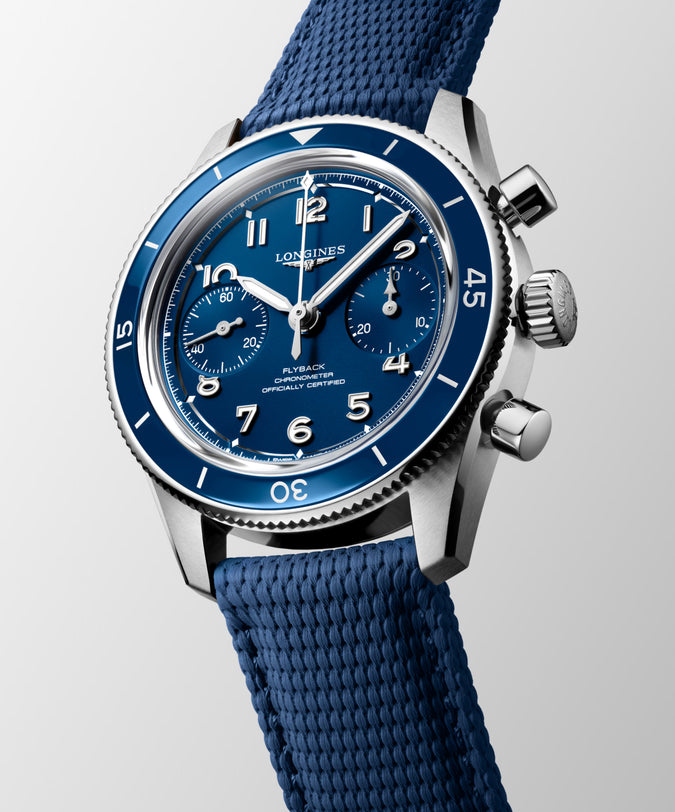 Longines Spirit Pilot Flyback chronograph watch with blue dial, stainless steel case, blue rubber strap, and chronograph subd