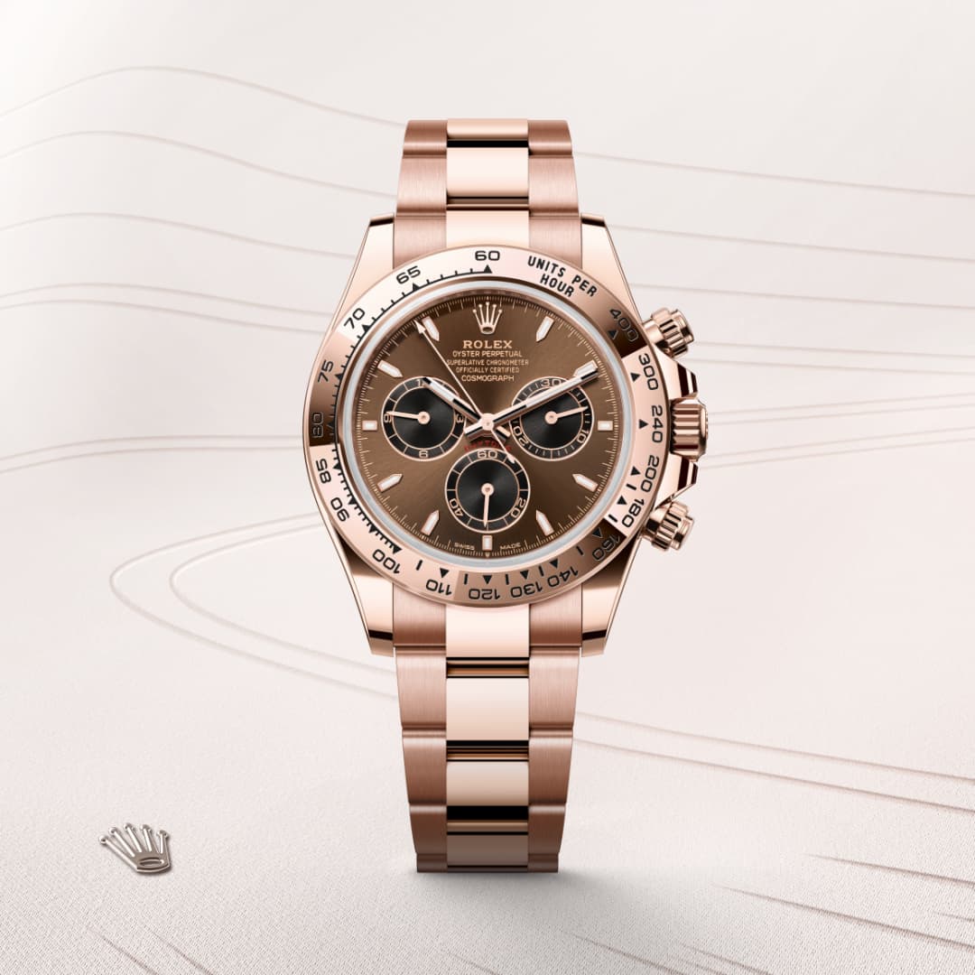 A rose gold Rolex Daytona watch with a brown dial and three subdials, displayed on a light background.