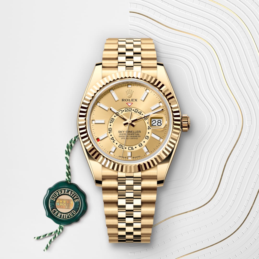 A gold Rolex Sky-Dweller watch with a champagne dial and Superlative Certified tag on a patterned background.