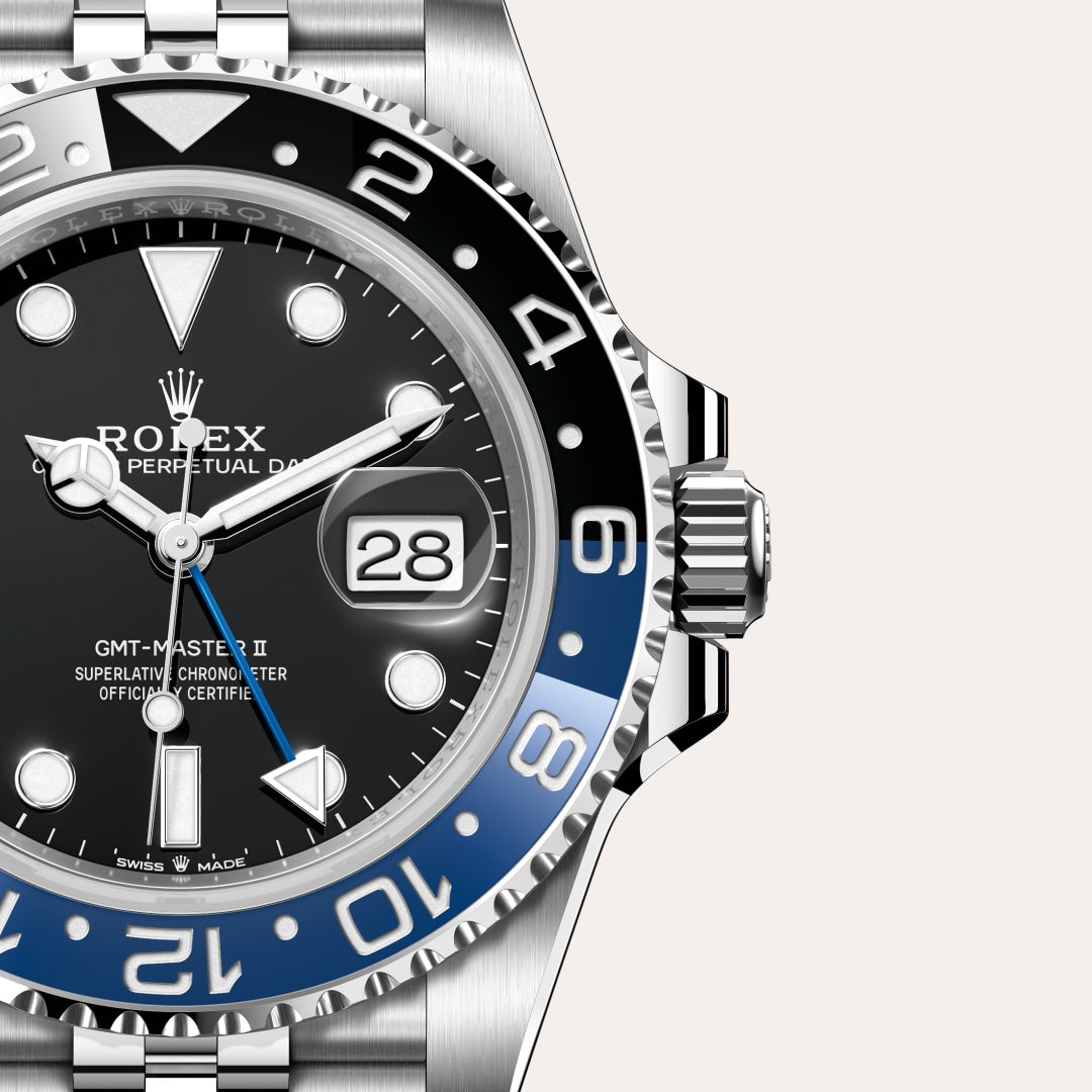 Close-up of a Rolex GMT-Master II watch with a black and blue bezel and the date showing 28.