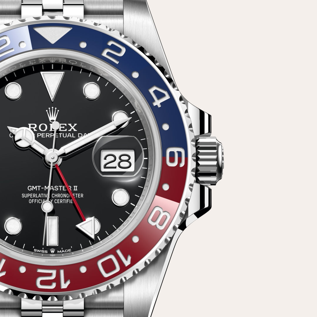 Close-up of a Rolex GMT-Master II watch with red and blue bezel, black dial, and date display.