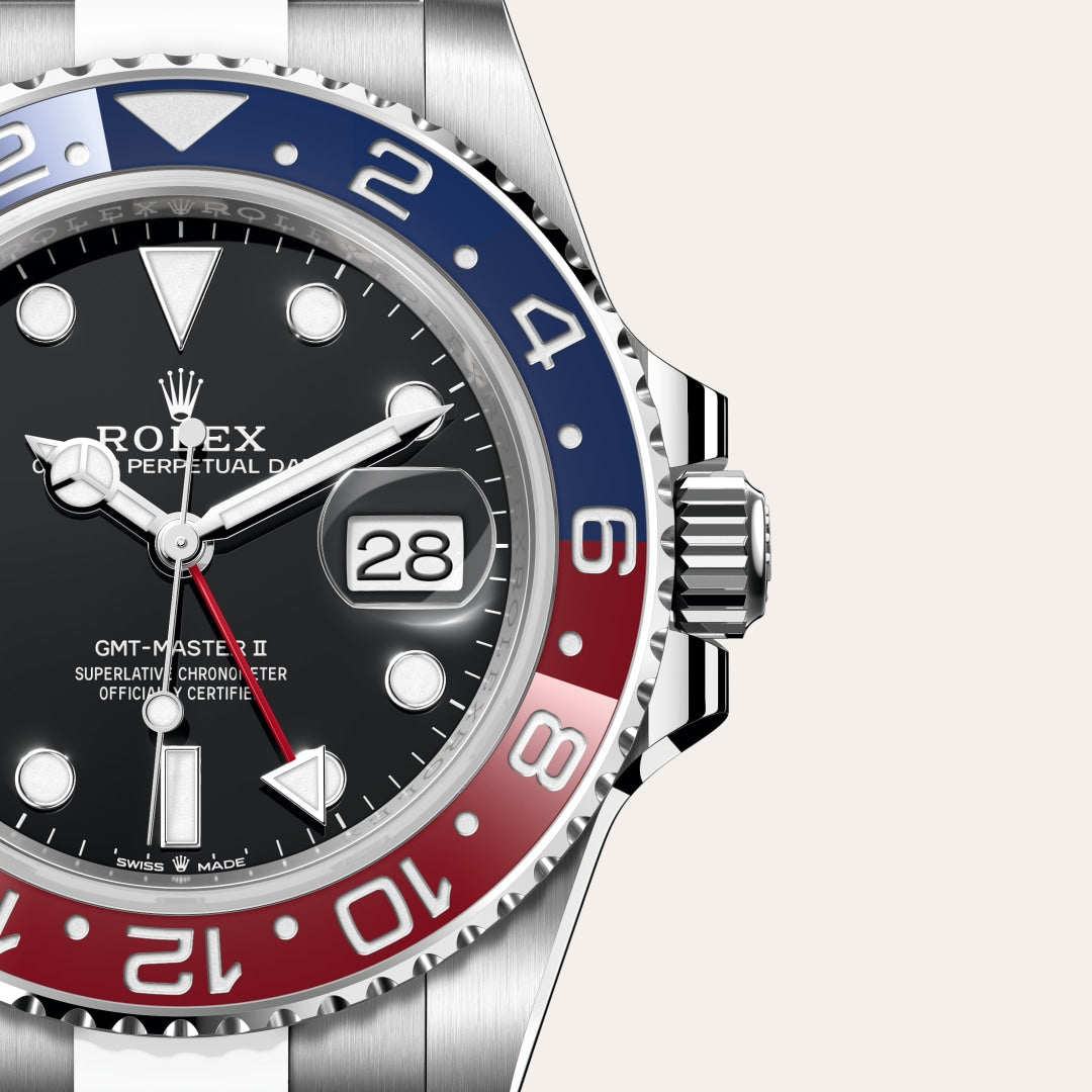 Close-up of a Rolex GMT-Master II watch with a black dial and red-blue bezel showing the date at 28.
