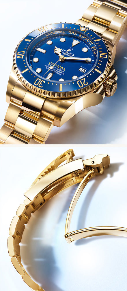 A gold Rolex dive watch with a blue dial and a matching gold bracelet, shown in close-up detail.