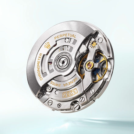 Close-up of a Rolex watch movement showcasing intricate gears and engraved golden text on a metallic surface.