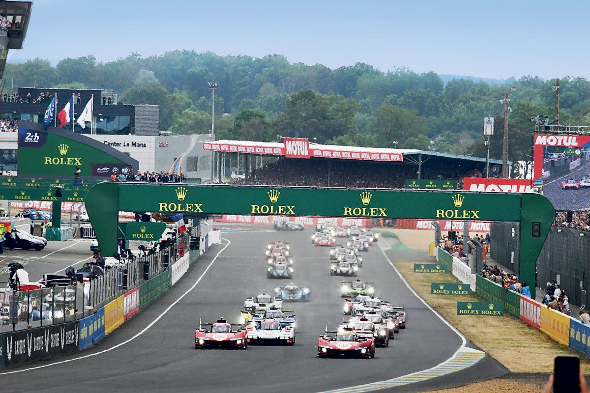 Multiple race cars driving at the Endurance championship race