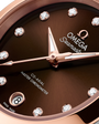 OMEGA Seamaster Aqua Terra 150M 30mm, Sedna™ gold on steel, Sedna™ gold Bezel, Brown Dial Watch with Diamond Markers on a Sedna™ gold on steel integrated two-tone bracelet.