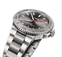 The Oris Aquis Date Relief, a stainless steel dive watch with a grey dial, date window, and rotating bezel, is shown angled on a white background.