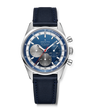 The Zenith Chronomaster Original is a chronograph wristwatch featuring a blue dial, silver subdials, and a blue leather strap.