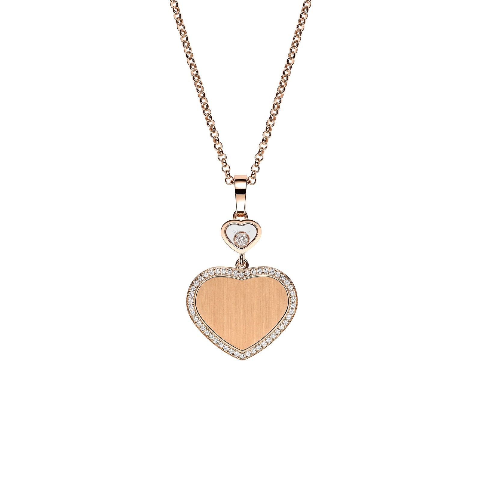 The Chopard Happy Hearts limited-edition gold necklace showcases a heart-shaped diamond pendant encircled by small diamonds, with a smaller heart and single diamond above, set against a white background.