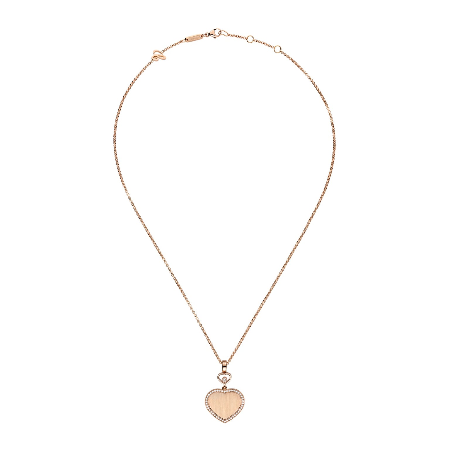 The Chopard Happy Hearts limited-edition gold necklace features a thin chain and a heart-shaped pendant outlined with sparkling crystals.