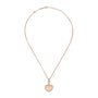 The Chopard Happy Hearts limited-edition gold necklace features a thin chain and a heart-shaped pendant outlined with sparkling crystals.