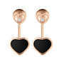 Chopard Happy Diamonds rose gold earrings feature black heart pendants with small clear stones set above each heart.
