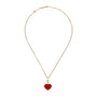 The Chopard Happy Hearts necklace features a delicate 18ct rose gold chain with a striking red heart-shaped pendant at the center.