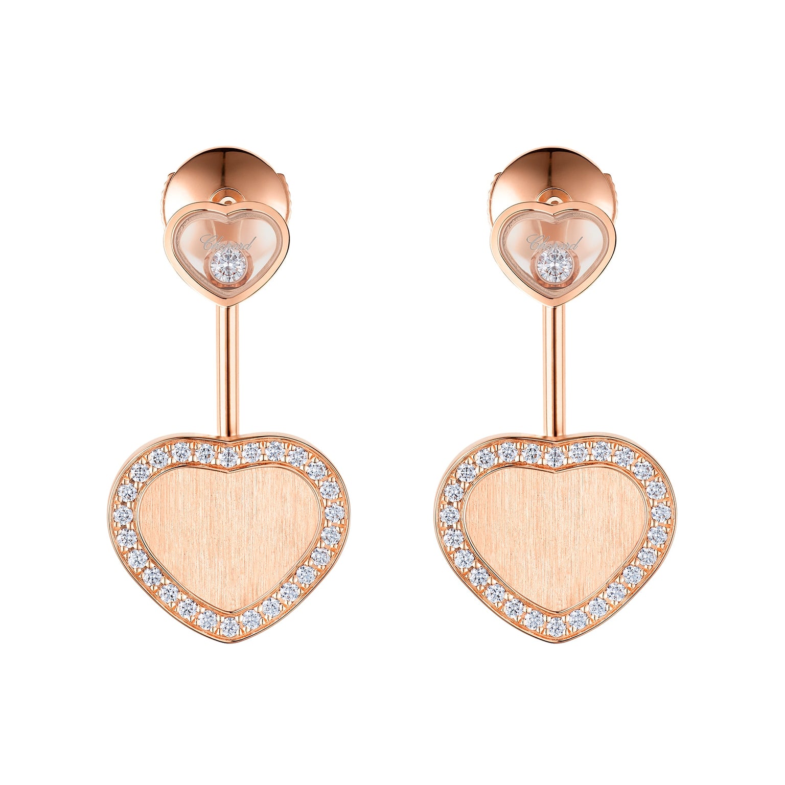From Chopard’s Happy Hearts limited edition, these ethical rose gold earrings showcase large diamond-bordered heart pendants paired with smaller heart studs featuring a central diamond—a stunning statement for the James Bond Woman.