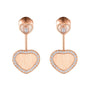 From Chopard’s Happy Hearts limited edition, these ethical rose gold earrings showcase large diamond-bordered heart pendants paired with smaller heart studs featuring a central diamond—a stunning statement for the James Bond Woman.