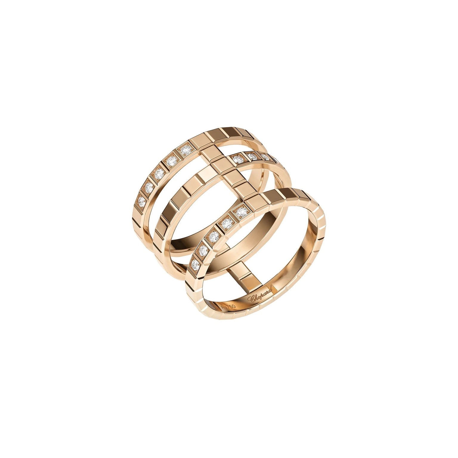 The Chopard Ice Cube ring features three parallel gold bands, each set with square-cut diamonds in a grid pattern, reflecting minimalist elegance and shown on a white background.