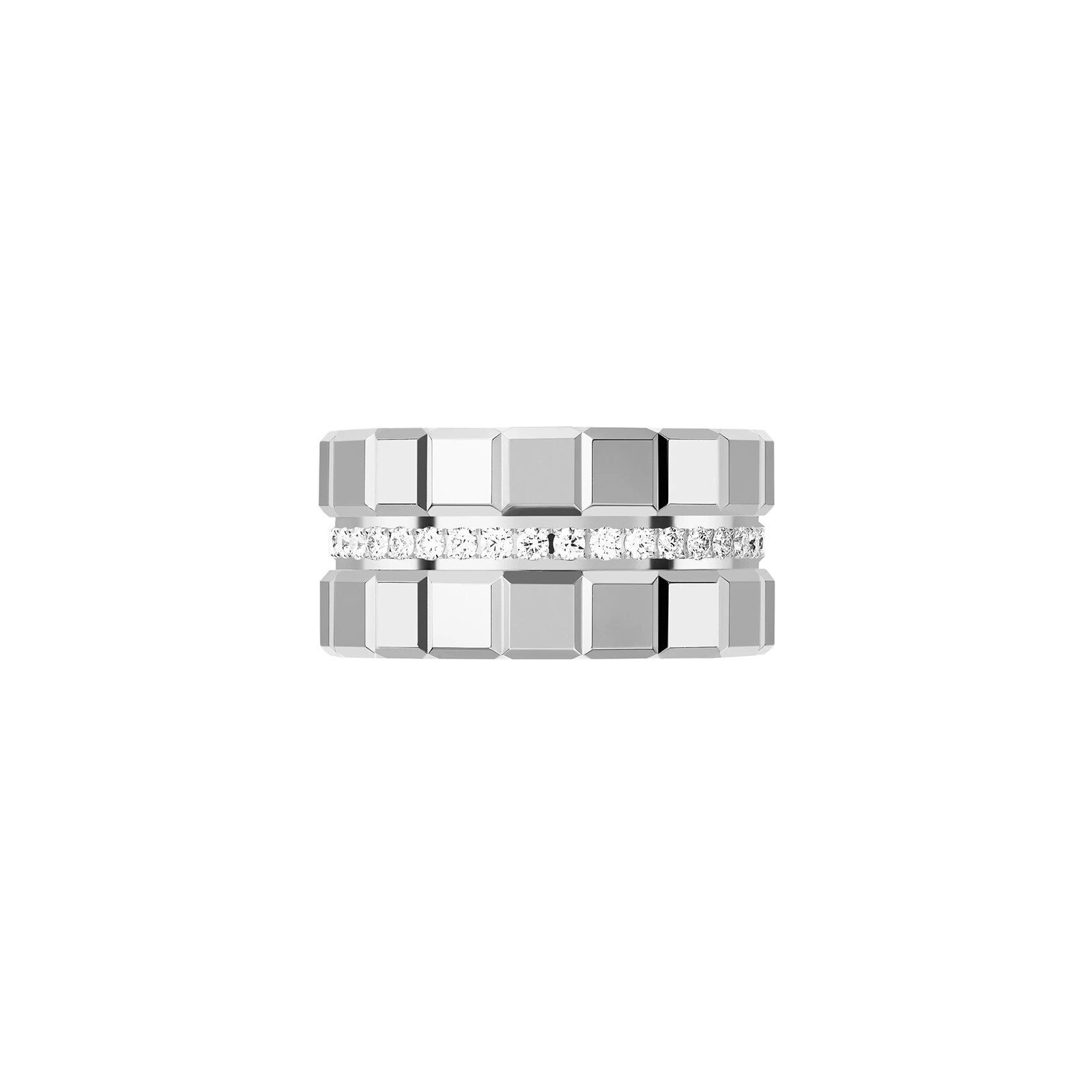 The Chopard Ice Cube ring features a wide silver band with a geometric block pattern and a central row of clear gemstones, showcasing minimalist elegance and modern style.