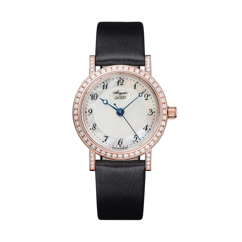 The Breguet Classique 8068 is a round luxury wristwatch in 18-carat gold, featuring a white textured dial, blue hour and minute hands, a diamond bezel, and a black leather strap.