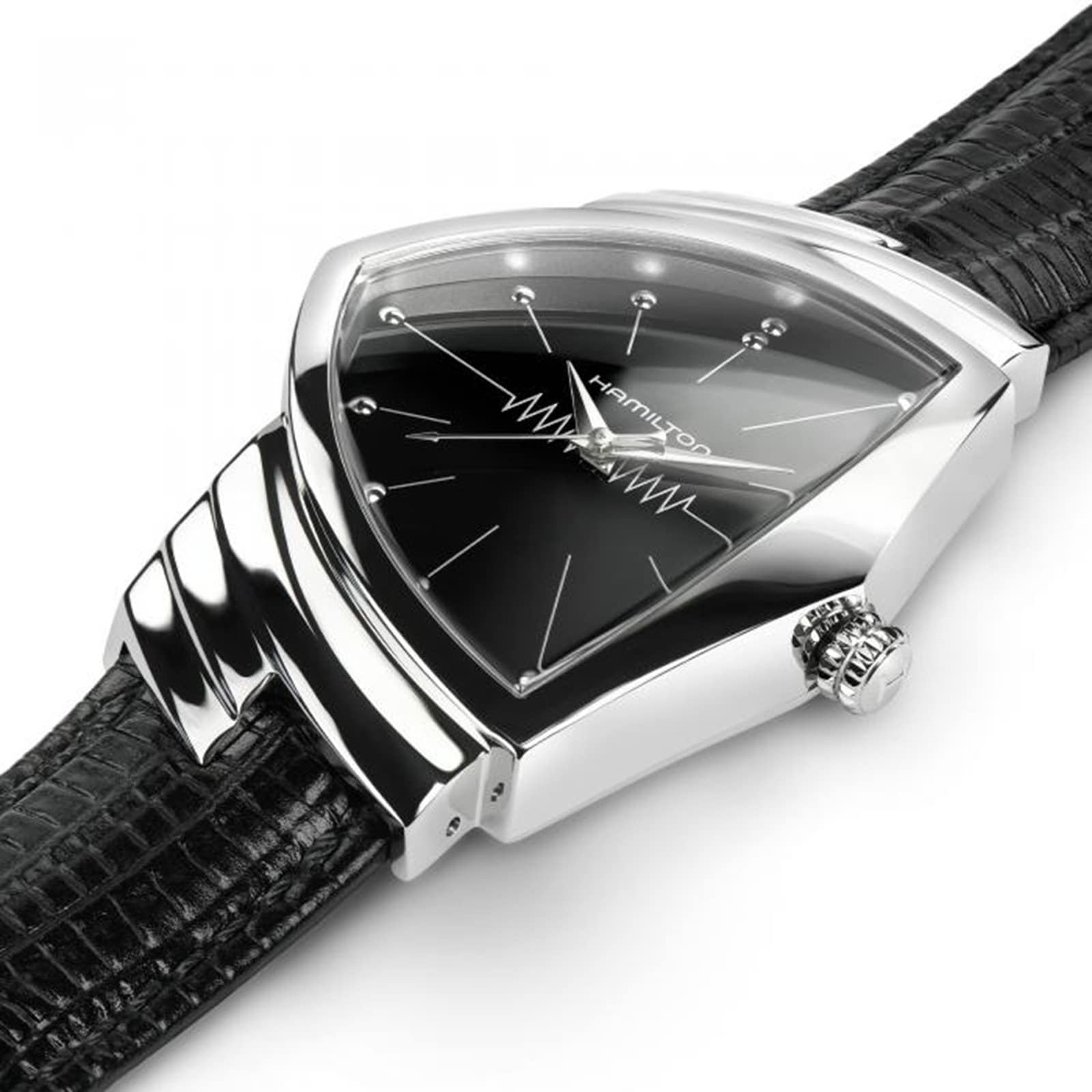 A close-up of the Hamilton Ventura Quartz wristwatch, featuring a triangular black dial, silver case, and black textured leather strap that highlights its iconic Mid-Century Modern design.