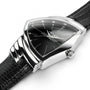 A close-up of the Hamilton Ventura Quartz wristwatch, featuring a triangular black dial, silver case, and black textured leather strap that highlights its iconic Mid-Century Modern design.