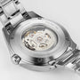 Close-up of the back of a Hamilton Khaki Aviation Pilot Day Date Auto wristwatch, featuring a transparent caseback that reveals the automatic movement and engravings denoting specifications and Swiss origin.