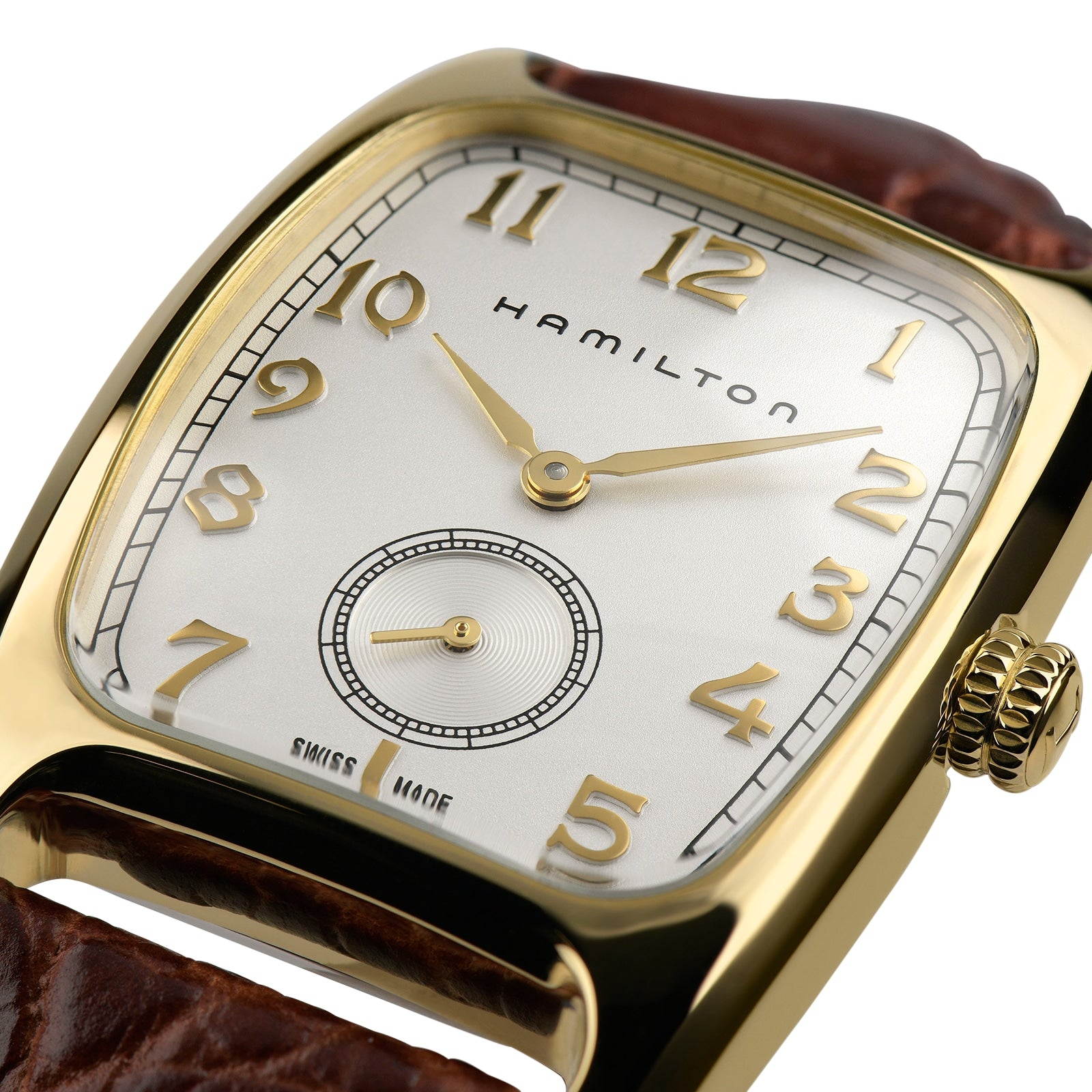 Close-up of the Hamilton American Classic Boulton Quartz, featuring a gold rectangular case, white dial with gold numerals, subdial at 6 oclock, and a brown leather strap—highlighting Swiss precision craftsmanship.