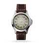 The Hamilton Khaki Field King Auto features a beige dial with black numerals, military time display, day-date at 12 oclock, and a brown leather strap with white stitching.