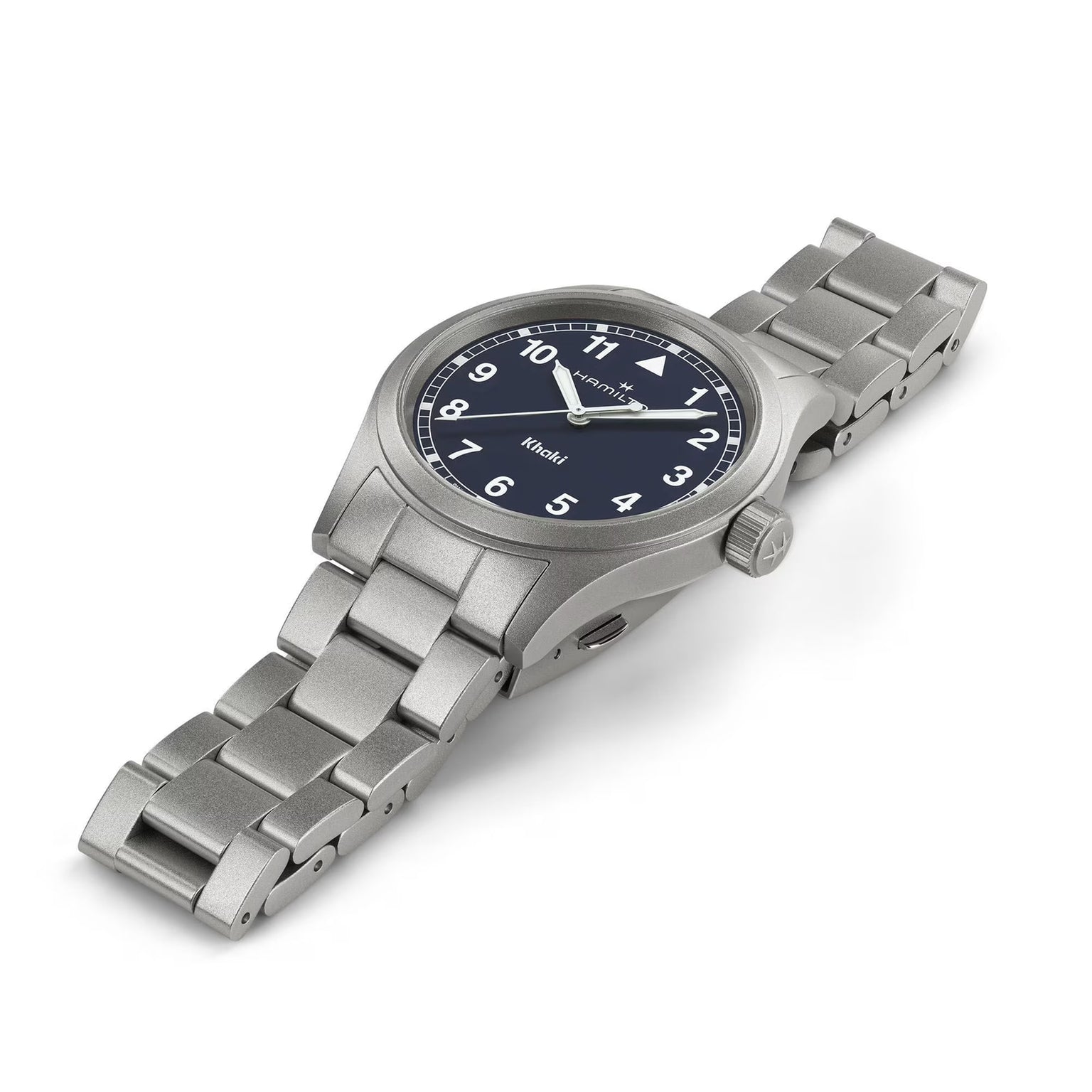 The Hamilton Khaki Field Quartz 38mm features a stainless steel case, black dial with white numerals, and a metal link band, displayed at an angle.