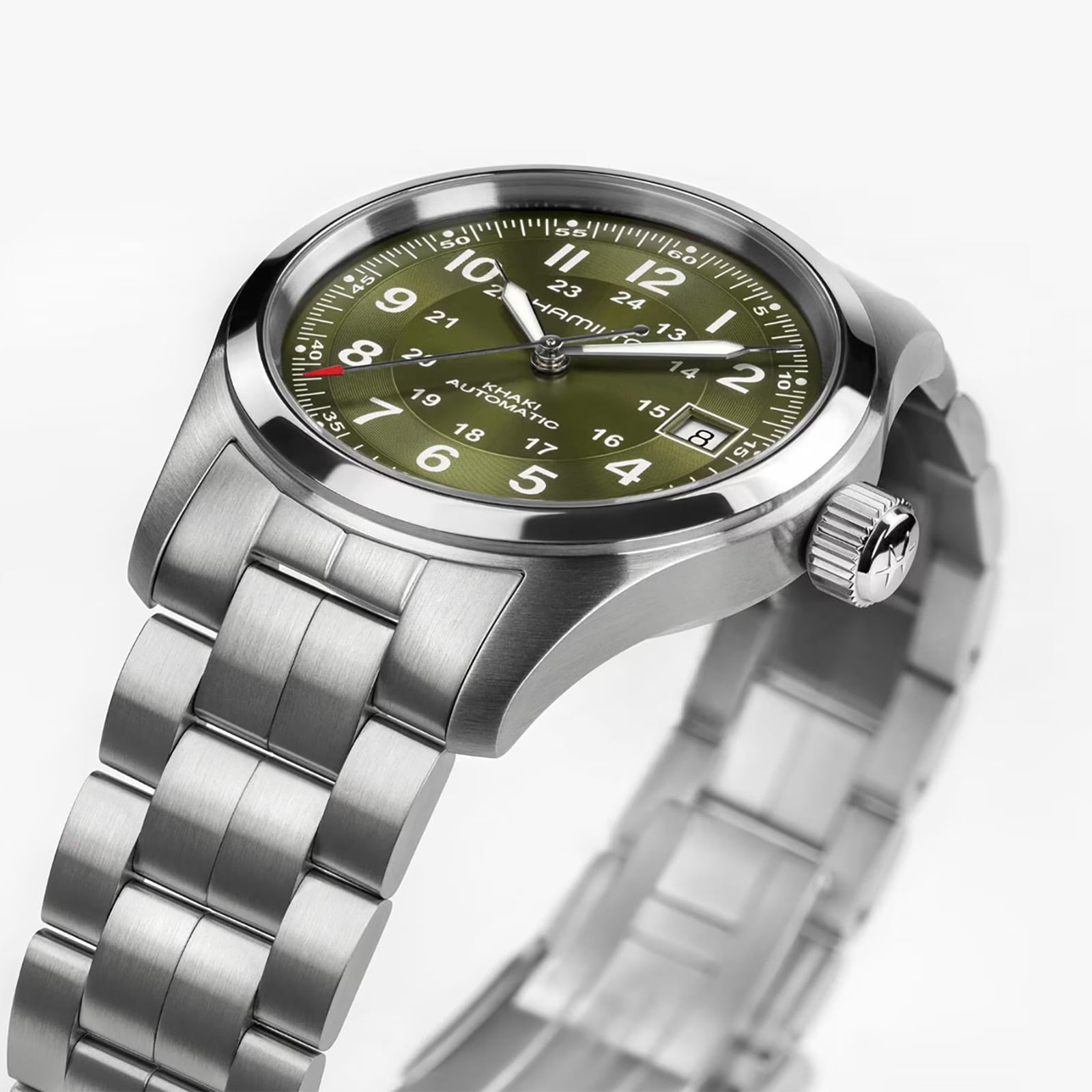 The Hamilton Khaki Field Auto 38mm features a stainless steel case, olive green dial with white numerals, and a metal link band.
