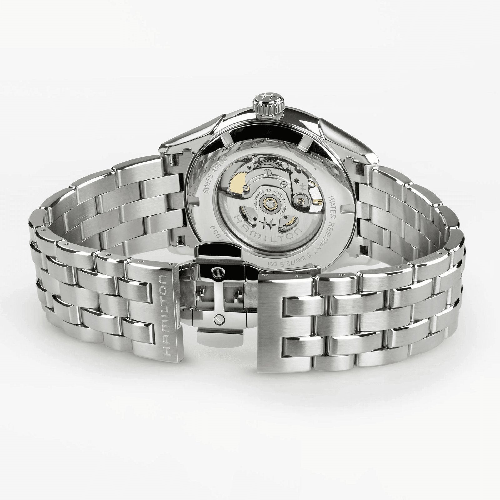 The Hamilton Jazzmaster Open Heart Auto 42mm features a stainless steel case, open clasp, and transparent case back that reveals its automatic movement—a stylish dress watch for those who admire elegant craftsmanship.