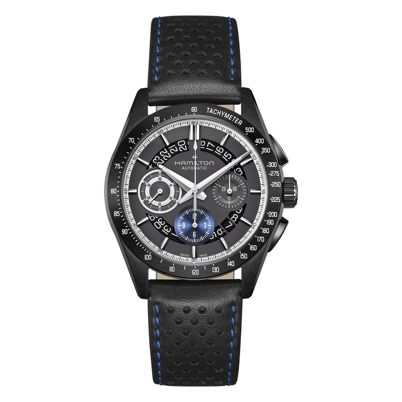 The Hamilton Jazzmaster Performer Autochrono 42mm pairs a black dial, tachymeter bezel, chronograph counters, blue accents, and a perforated leather strap with blue stitching for a sporty yet stylish look.