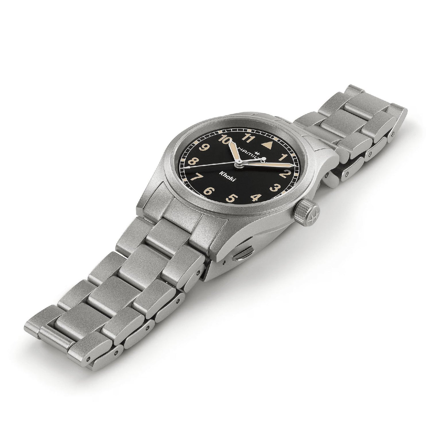 The Hamilton Khaki Field Quartz 33mm is a durable silver metal wristwatch with a black face, white numerals, and a metallic link band, displayed on a white surface—ideal for everyday wear or adventure.