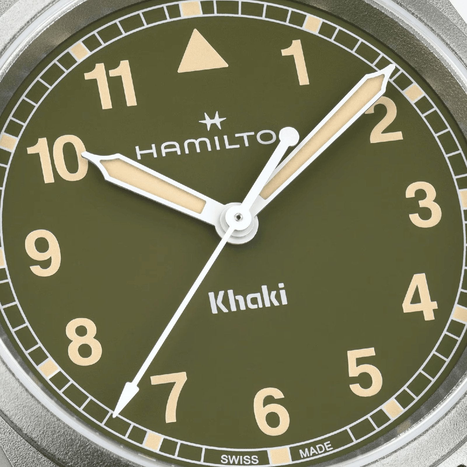 Close-up of the Hamilton Khaki Field Quartz 33mm watch featuring an olive green dial, cream hands and numerals, minute markers around the edge, and displaying the time 1:50:36—a testament to Hamilton’s adventurous legacy.