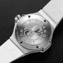 Close-up of the back of a Hublot Big Bang Steel White Diamonds watch with a brushed metal case, white rubber strap, engraved branding and serial number, plus a stainless steel bezel.