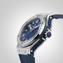 The Hublot Big Bang Steel Blue Diamonds wristwatch features a stainless steel bezel set with 36 diamonds, a blue sunray dial, and a blue leather strap, displayed at an angle on a light gray background.