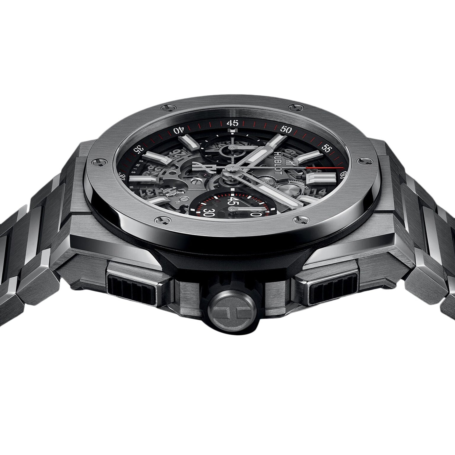A close-up of the Hublot Big Bang Integrated Titanium shows its skeleton dial, visible gears, bold self-winding chronograph, and brushed metal bracelet—all inspired by the Big Bang Unico design—against a white background.