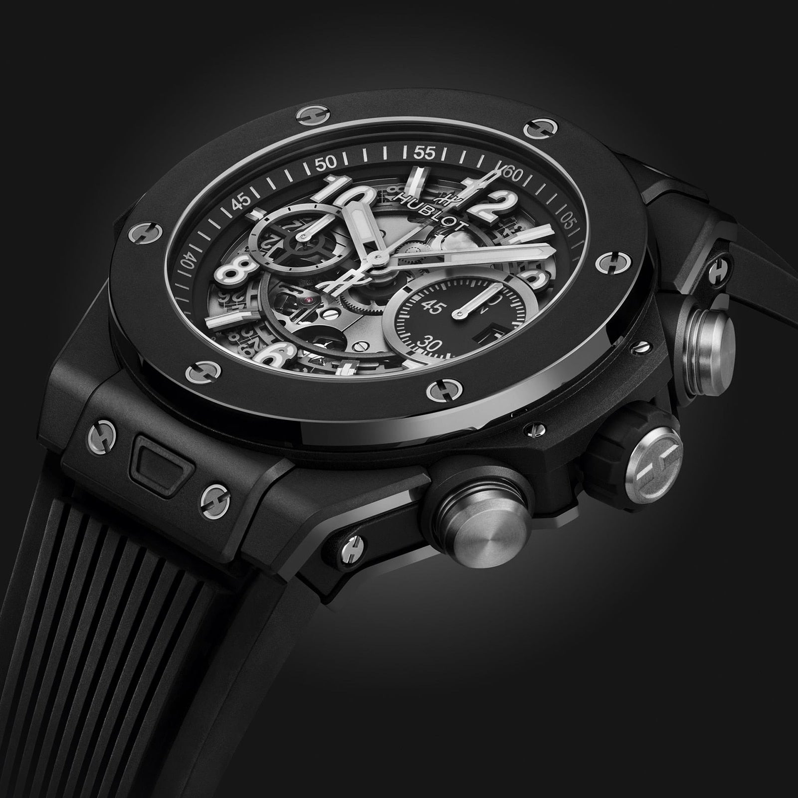 Close-up of the Hublot Big Bang Unico Black Magic, showcasing its UNICO movement, skeleton dial with visible mechanics, and textured side buttons—all highlighted against a dark background.