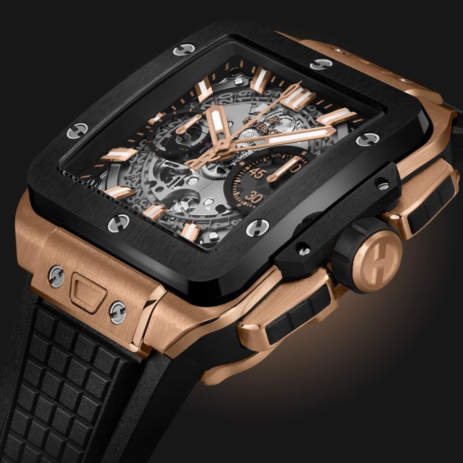 A close-up of the Hublot Square Bang Unico King Gold Ceramic, featuring a square face, visible HUB1280 UNICO movement, gold and black accents, and a textured black strap.