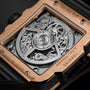 Close-up of the Hublot Square Bang Unico King Gold Ceramic’s back, showcasing its transparent case, intricate HUB1280 UNICO movement, and detailed engravings on an 18K King gold and black ceramic frame.