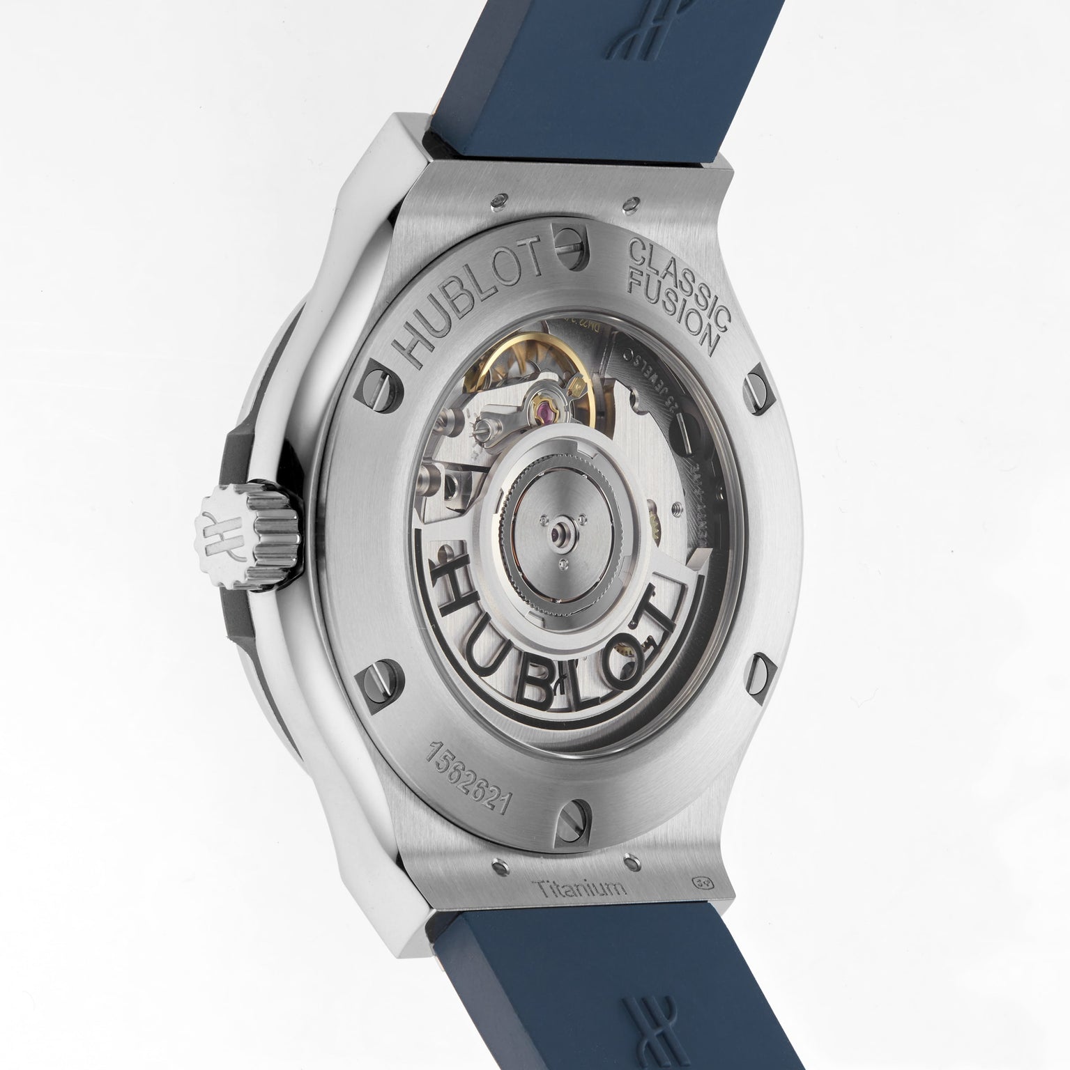 Back view of the Hublot Classic Fusion Titanium Blue, showing its self-winding movement through a transparent case back with visible engravings and a blue rubber strap. The titanium case brings modern elegance to this iconic watch.