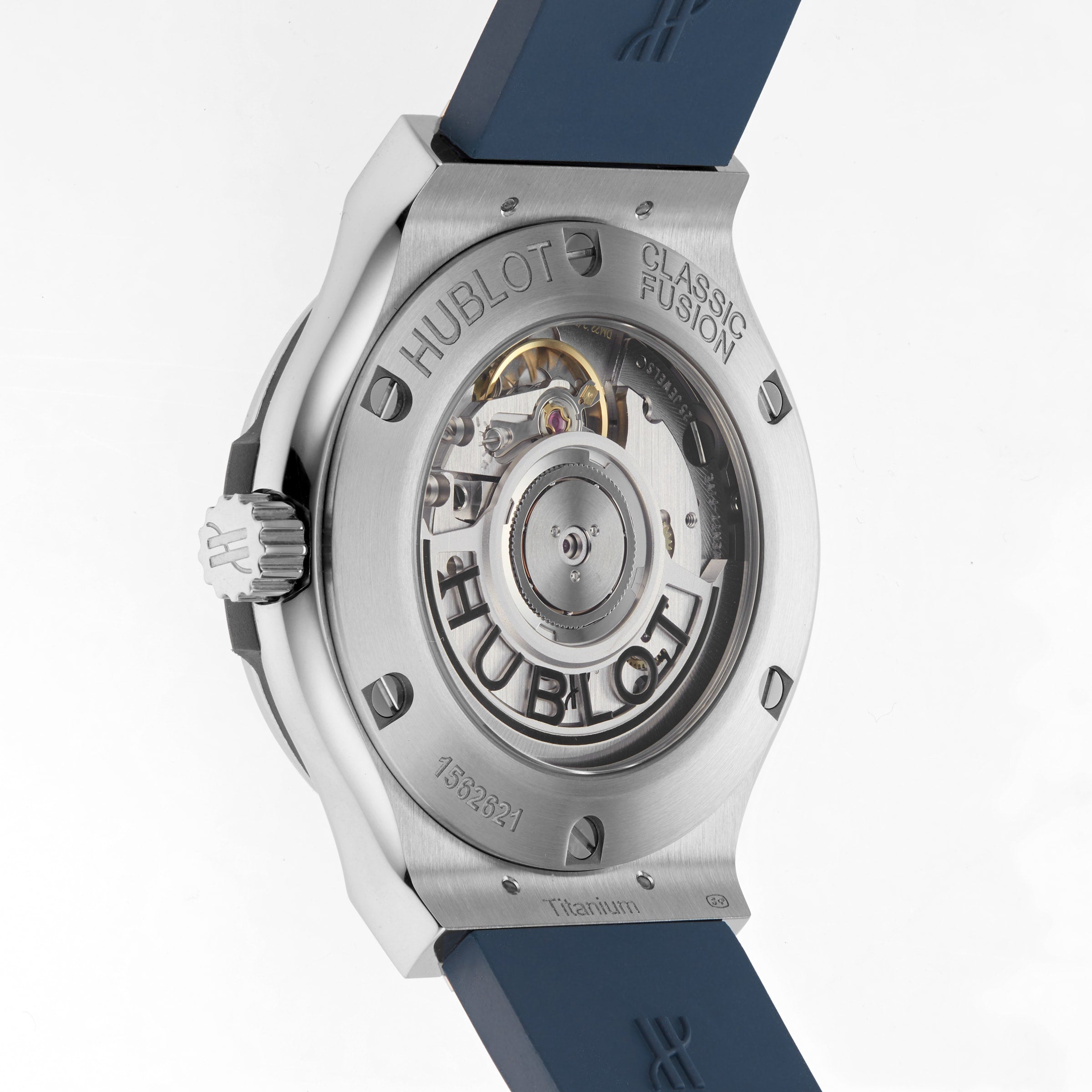 Back view of the Hublot Classic Fusion Titanium Blue, showing its self-winding movement through a transparent case back with visible engravings and a blue rubber strap. The titanium case brings modern elegance to this iconic watch.
