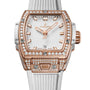 The Hublot Spirit Of Big Bang King Gold White Pavé is a luxury wristwatch featuring a white strap, King Gold case, diamond-set bezel and markers, and a date display at 6 o’clock.
