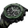 A close-up of the Hublot Big Bang Unico The Watches of Switzerland Group Exclusive, featuring a green bezel, skeleton dial, black case, and camouflage-patterned fabric strap.