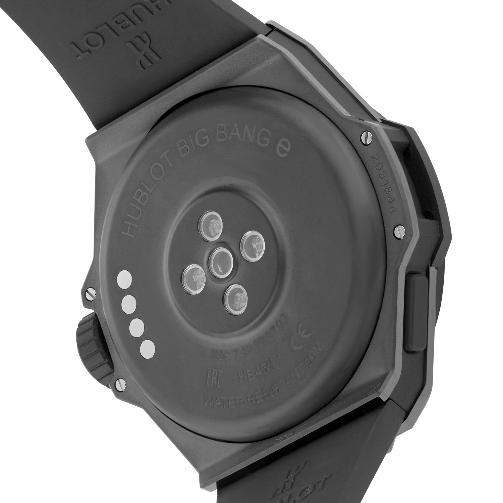 The back of the Hublot Big Bang E Gen3 Black Magic smartwatch from the iconic Big Bang collection displays charging contact points and engraved model details, highlighting its smart technology.