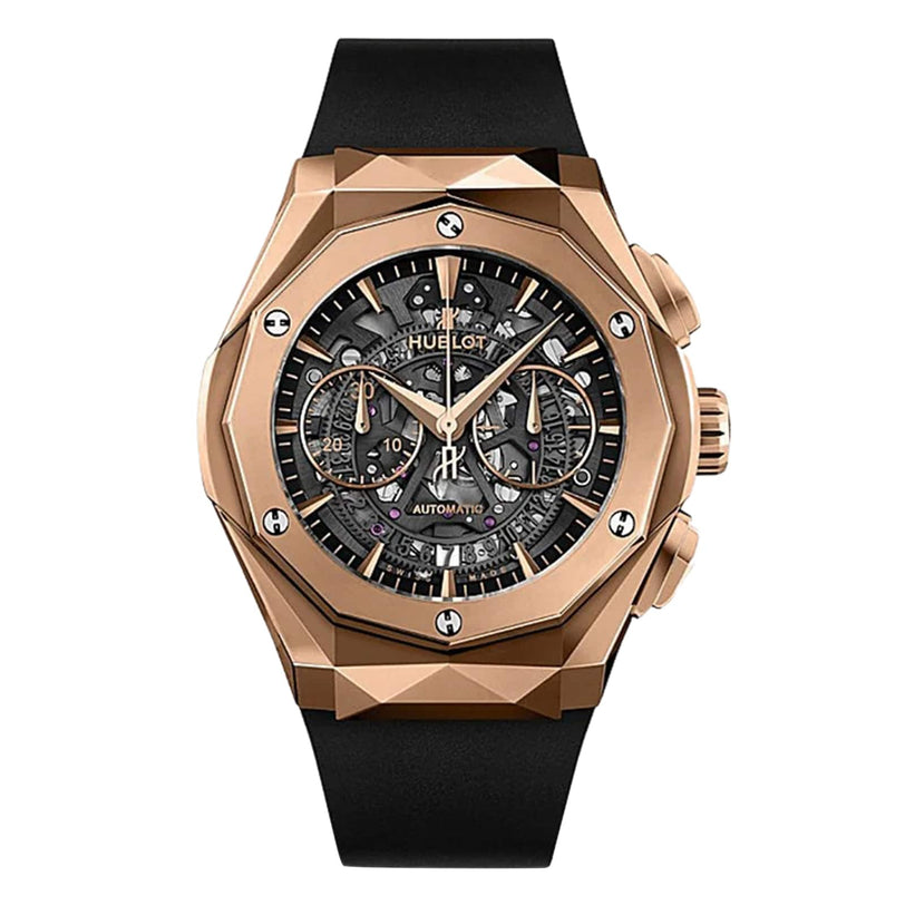 The Hublot Classic Fusion Aerofusion King Gold features a rose gold case, black skeleton dial with visible gears, two subdials, and a black rubber strap—exemplifying modern luxury in every detail.