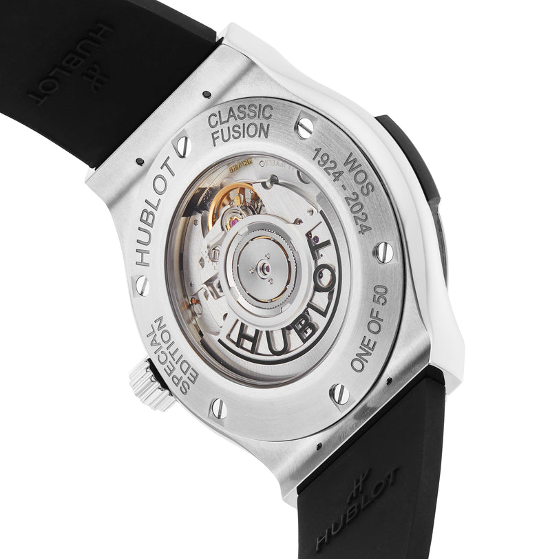 Back view of the Hublot Classic Fusion Centenary Special Edition, a Watches of Switzerland Group Exclusive, featuring an exposed movement, engraved text, and a black rubber strap.