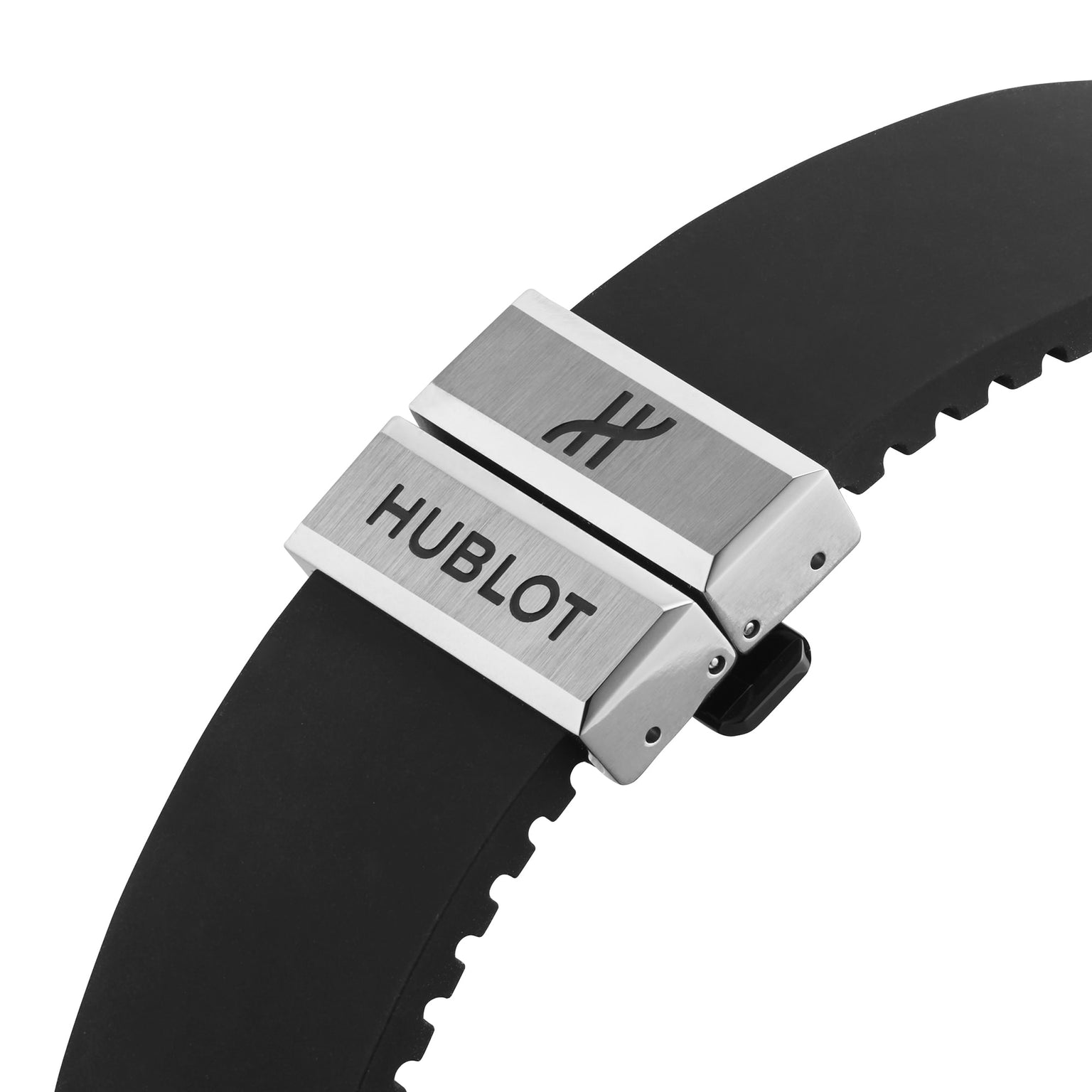 Close-up of a black rubber strap with a silver clasp engraved with the Hublot logo and name, from the Hublot Classic Fusion Centenary Special Edition––a Watches of Switzerland Group Exclusive.